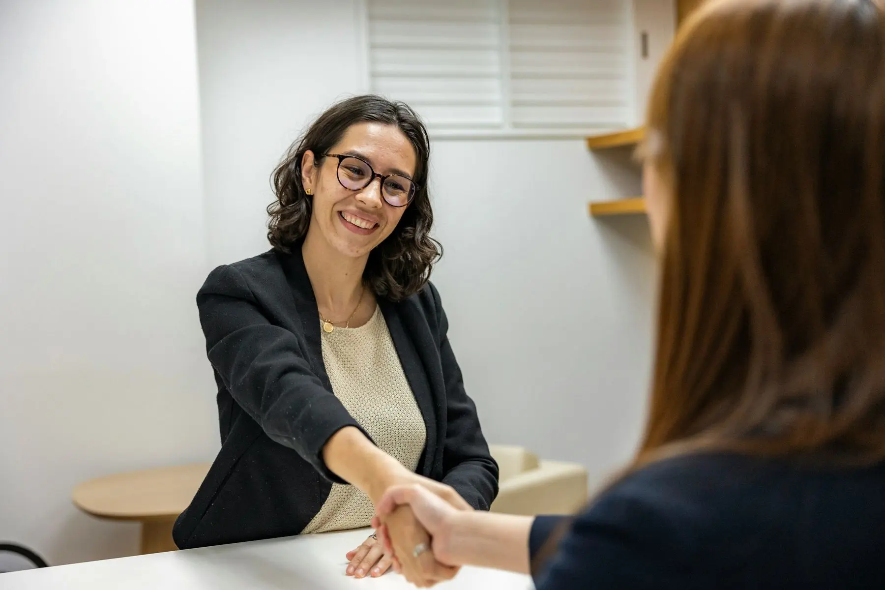 Candidate shaking hands with an interviewer during a mock interview
